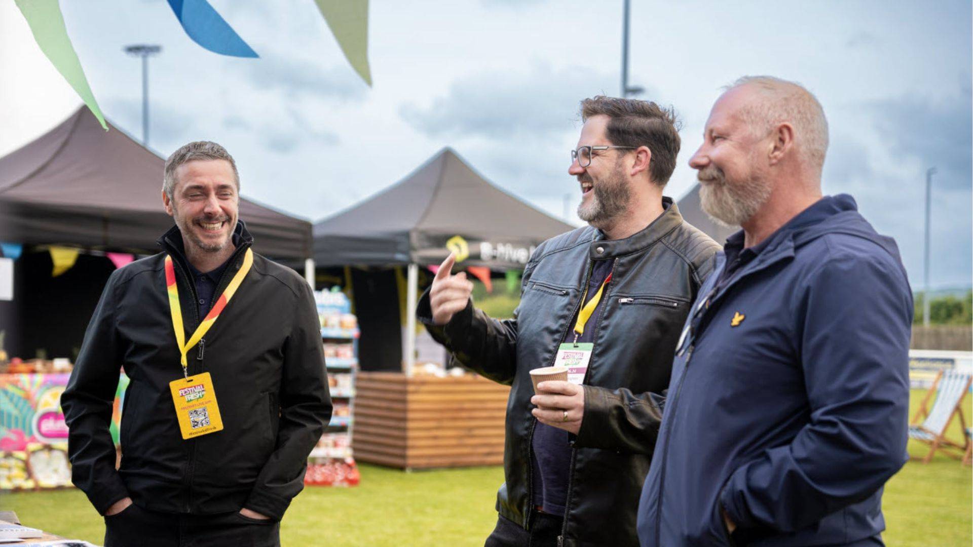 Tom Lee, Ben Messingham and Jason George from the Digipal team talking and smiling outdoors at a previous Festival of Fresh event.