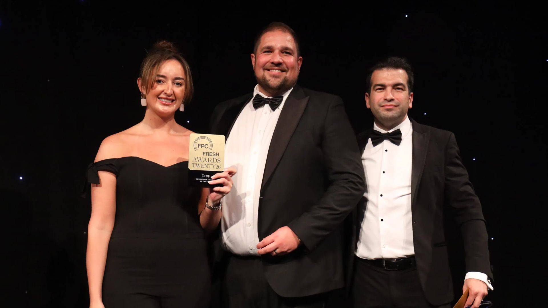 Mattan David (right) stands for a photo with award winners from Co-op.